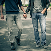 two men holding hands